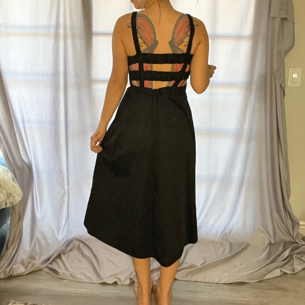 Size XS, TOPSHOP, smocked, black dress with back cutouts.